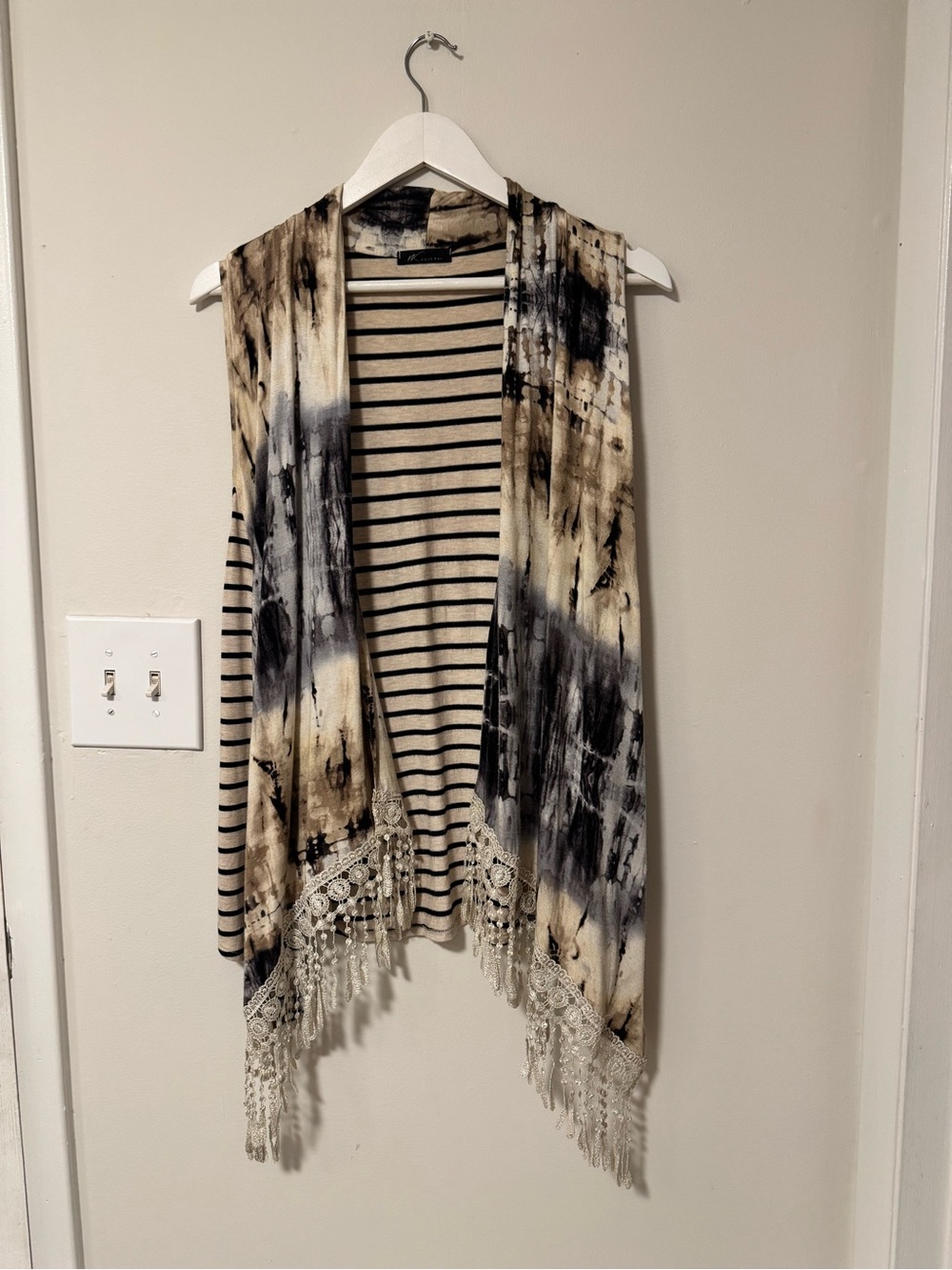 Striped and fringed vest.